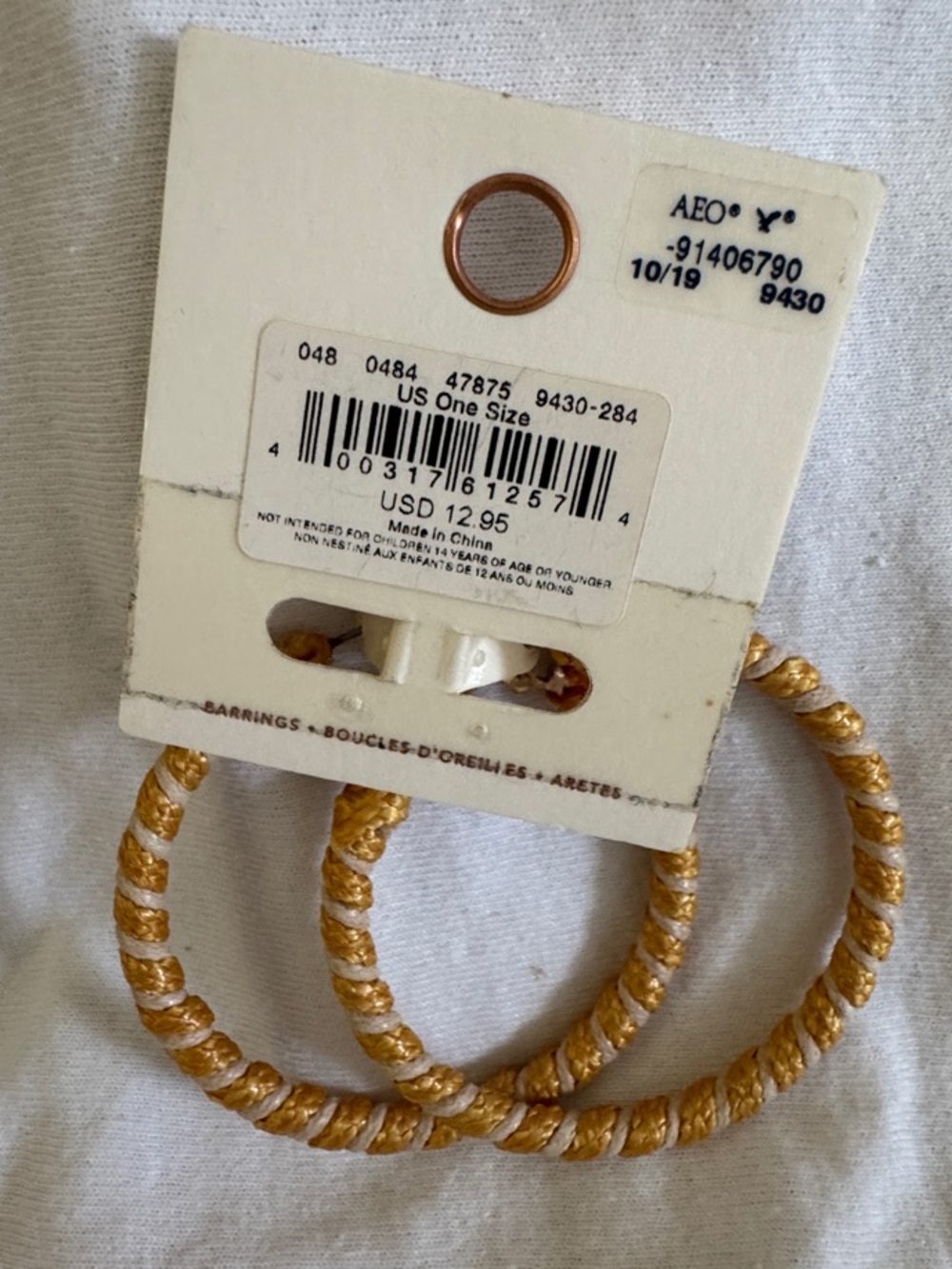 American Eagle Outfitters Gold and Cream Twisted Hoop Earrings - Picture 2 of 3